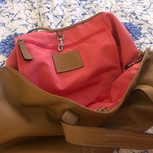 Tan leather Coach shoulder bag with pink interior